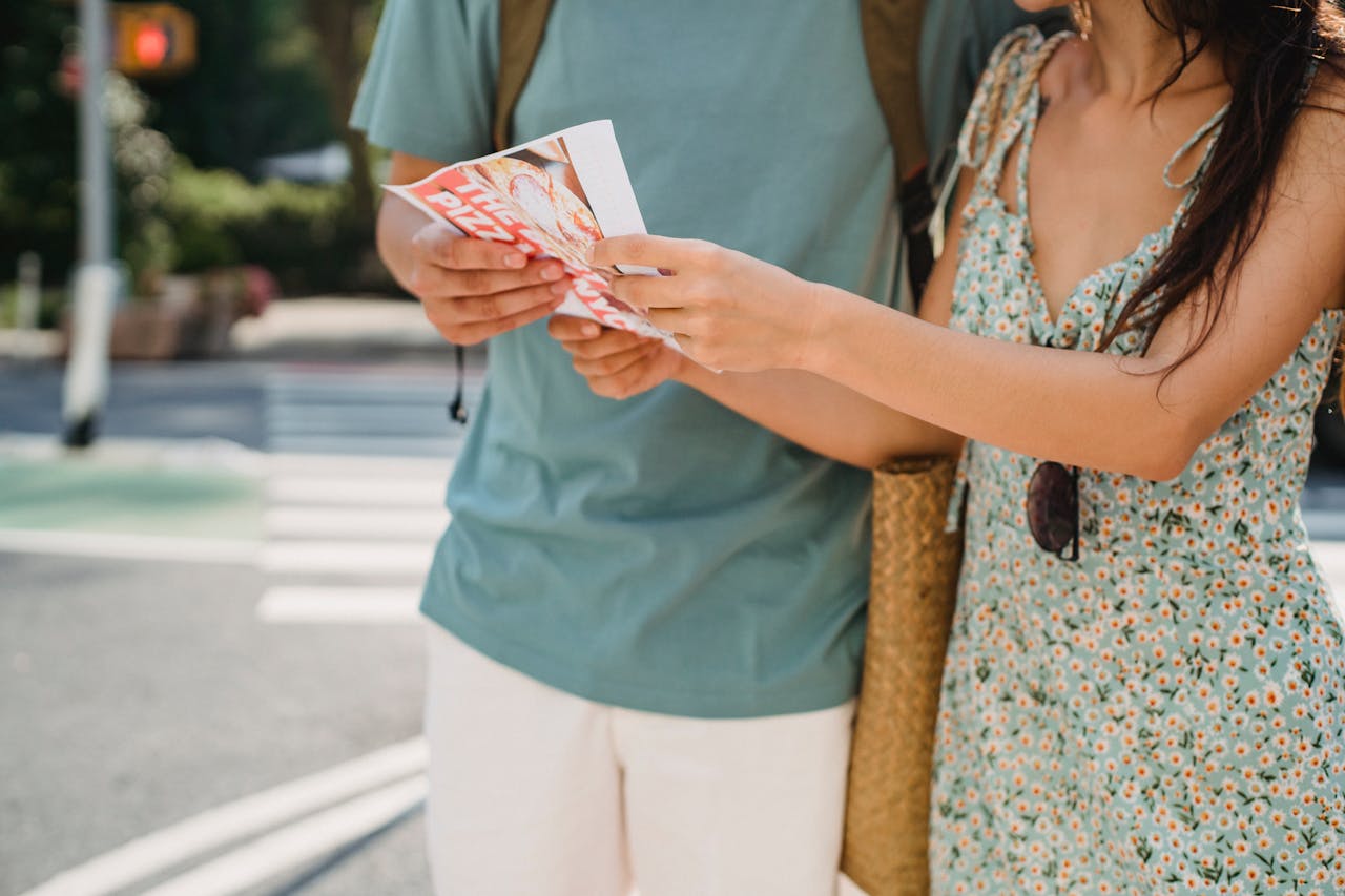 why-choose-us Crop anonymous couple searching direction in map while sightseeing together in city center during trip